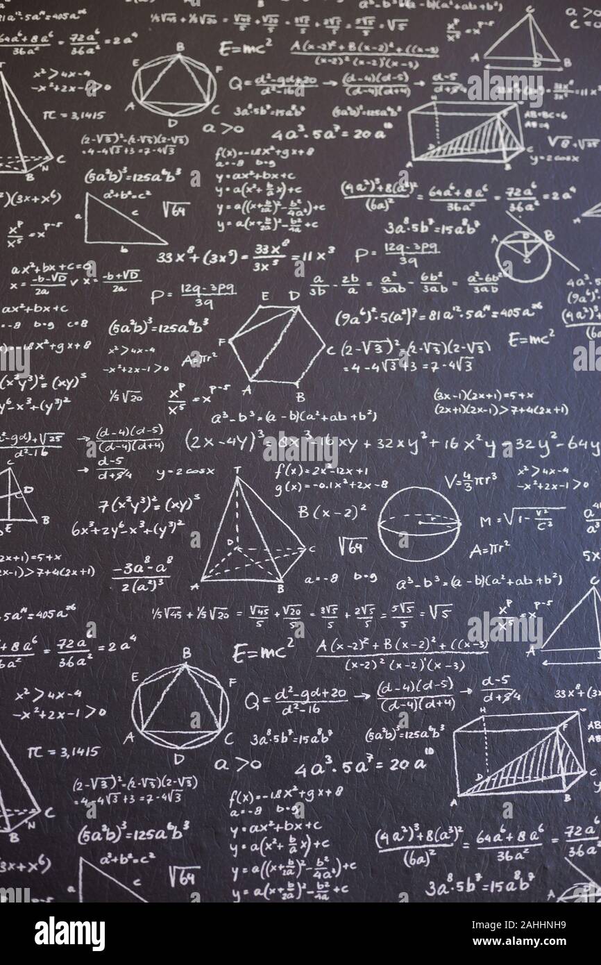 Math on black board with many solution vertical Stock Photo Alamy