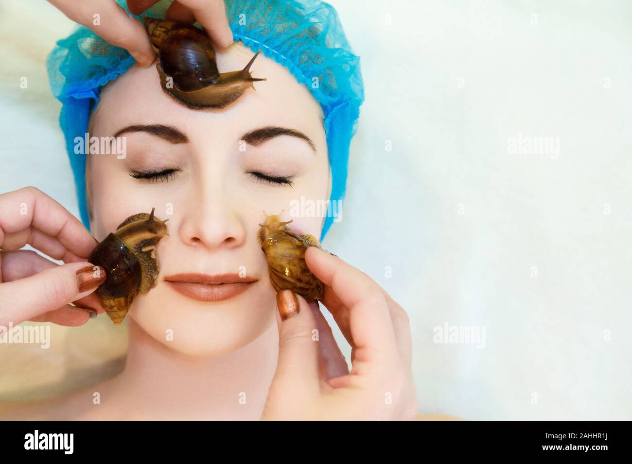 Lifting and facial massage of a young woman rejuvenates the skin in an