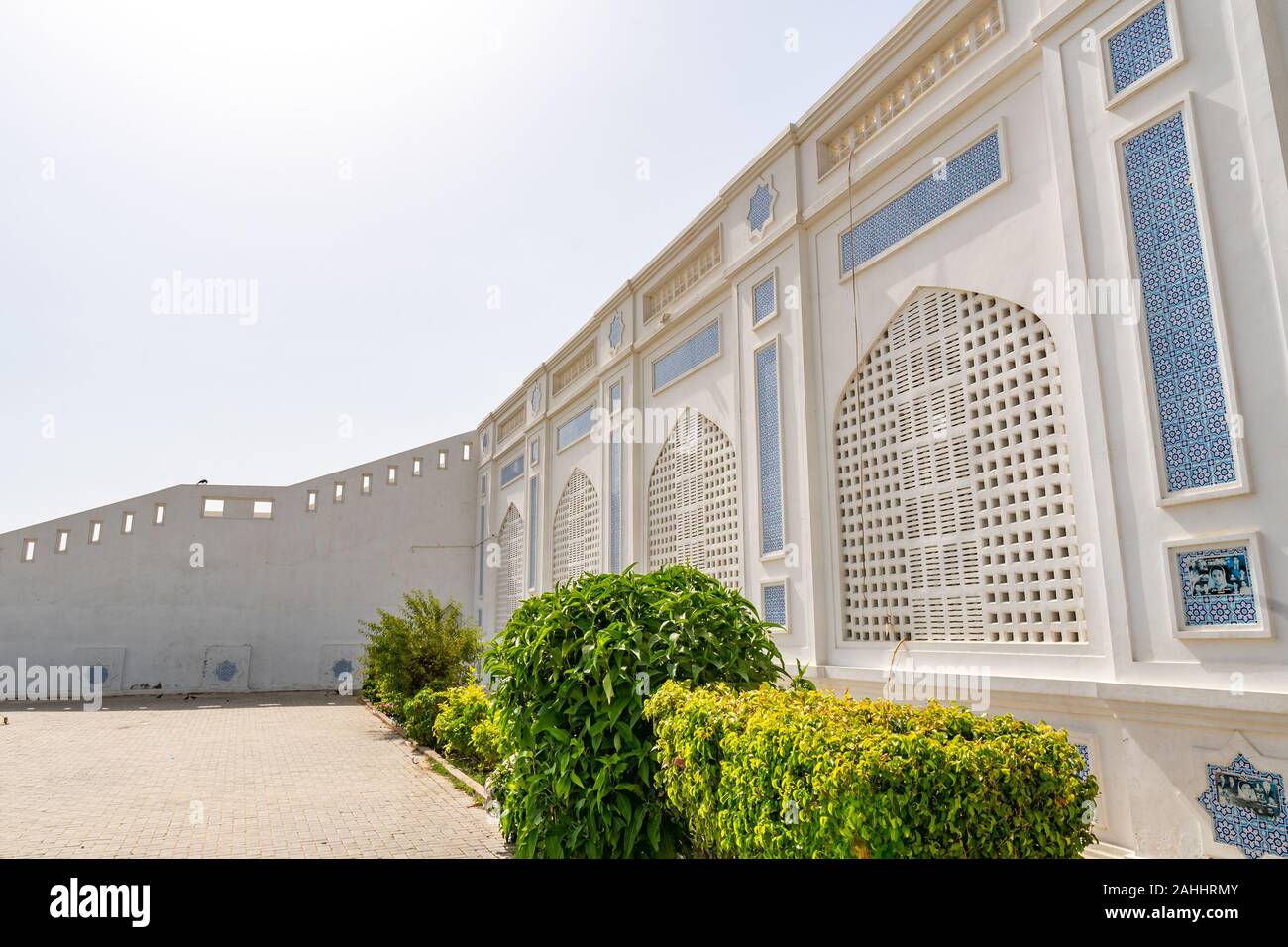Larkana Bhutto Family Mausoleum Picturesque View of the Facade Windows on a Sunny Blue Sky Day Stock Photo