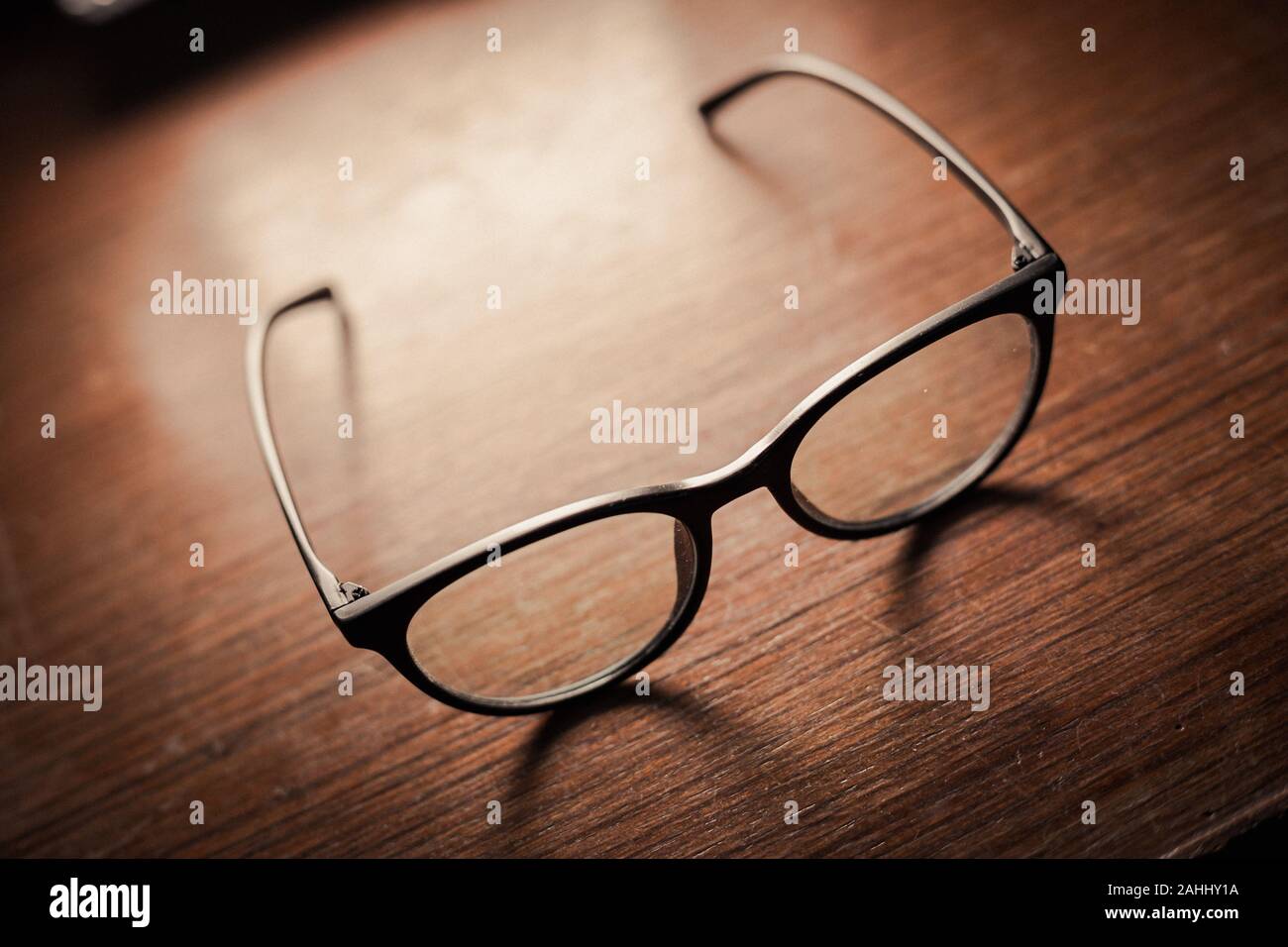 luxury eye glasses that leave after wearing on wood table Stock Photo