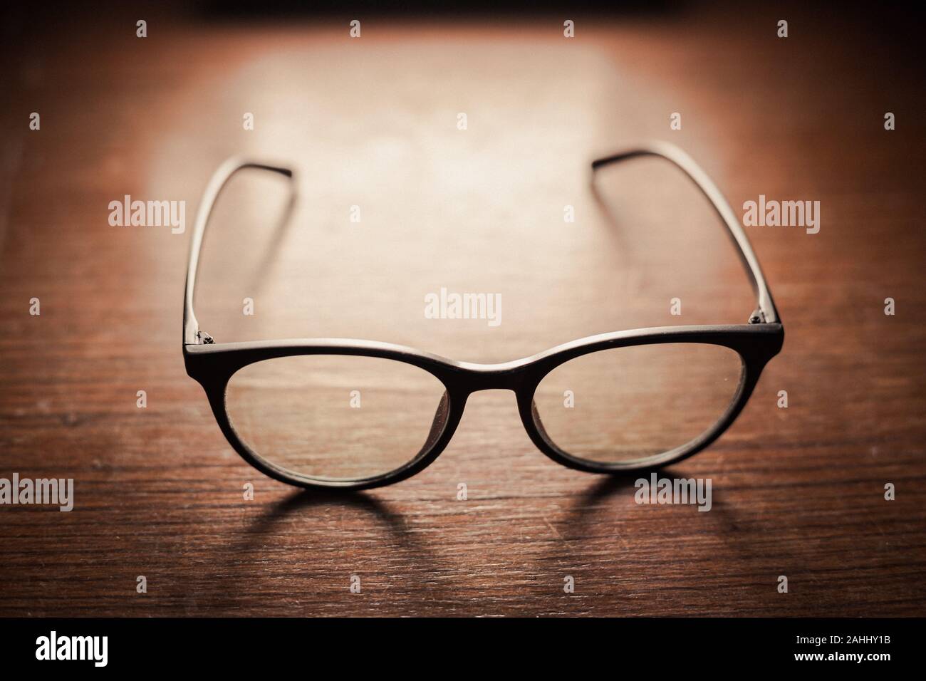 luxury eye glasses that leave after wearing on wood table Stock Photo