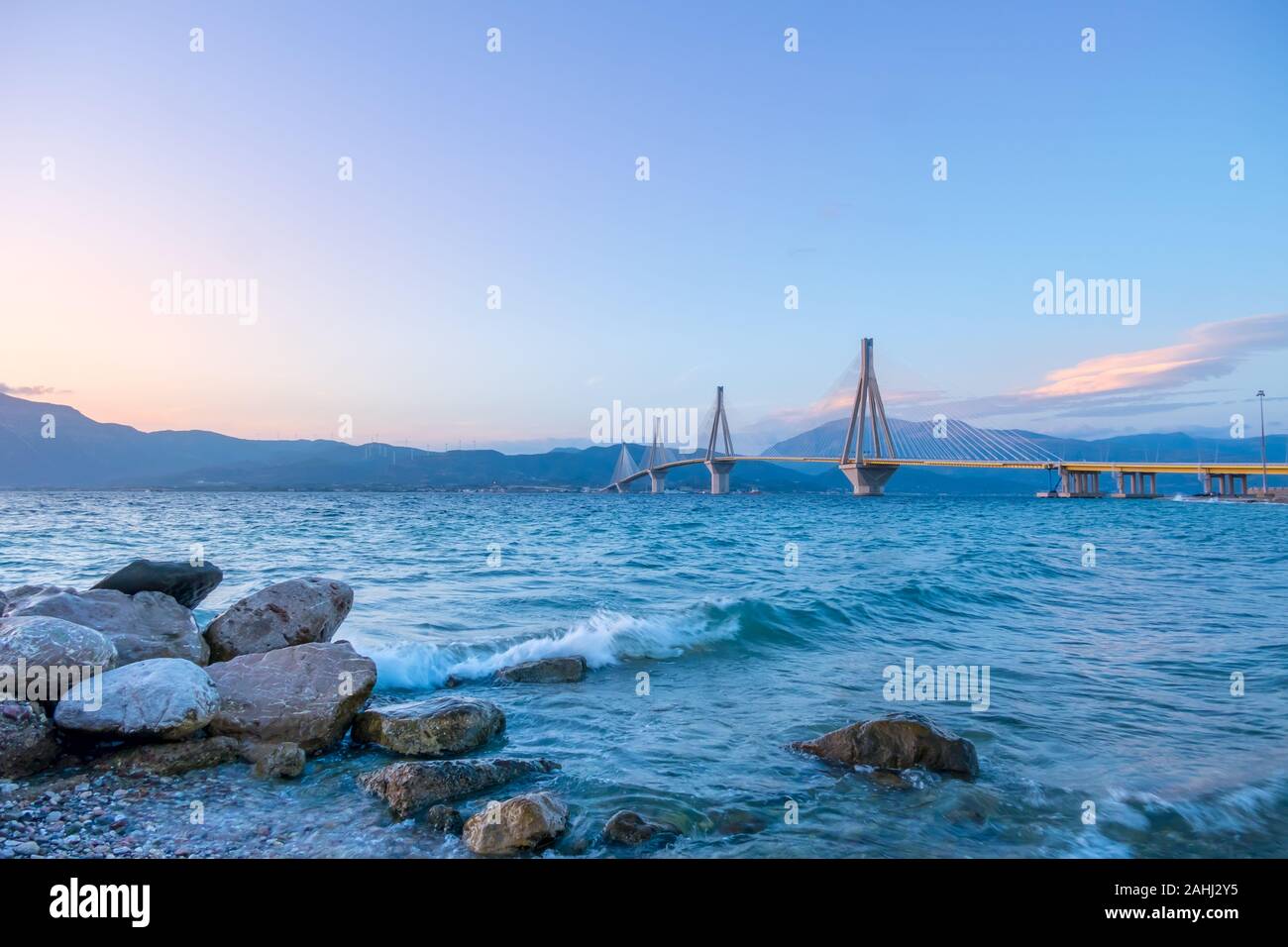 Greek cable-stayed bridge over the Gulf of Corinth. Rion-Antirion. Clear evening sky over the mountain shore Stock Photo
