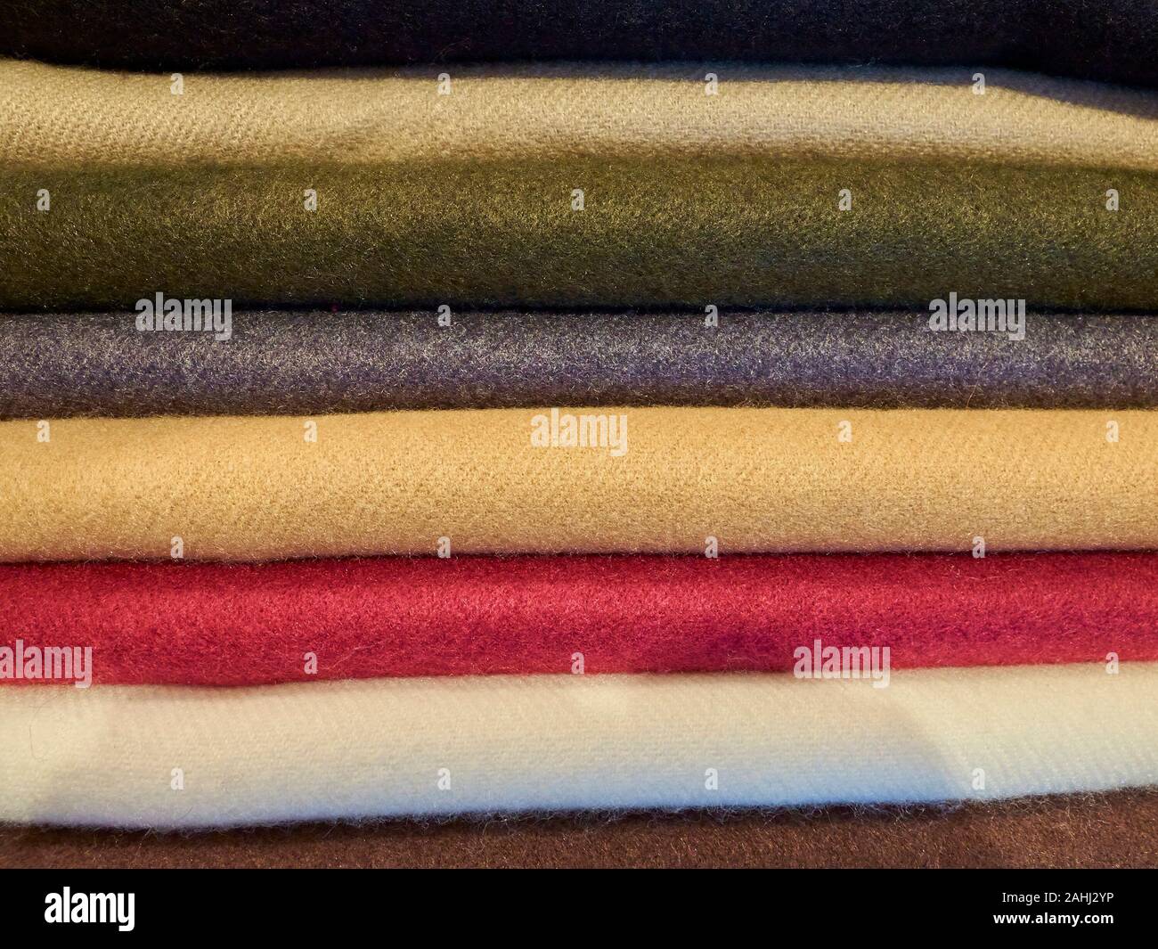 Piled turkish multi colored cashmere fabric pieces. Stock Photo