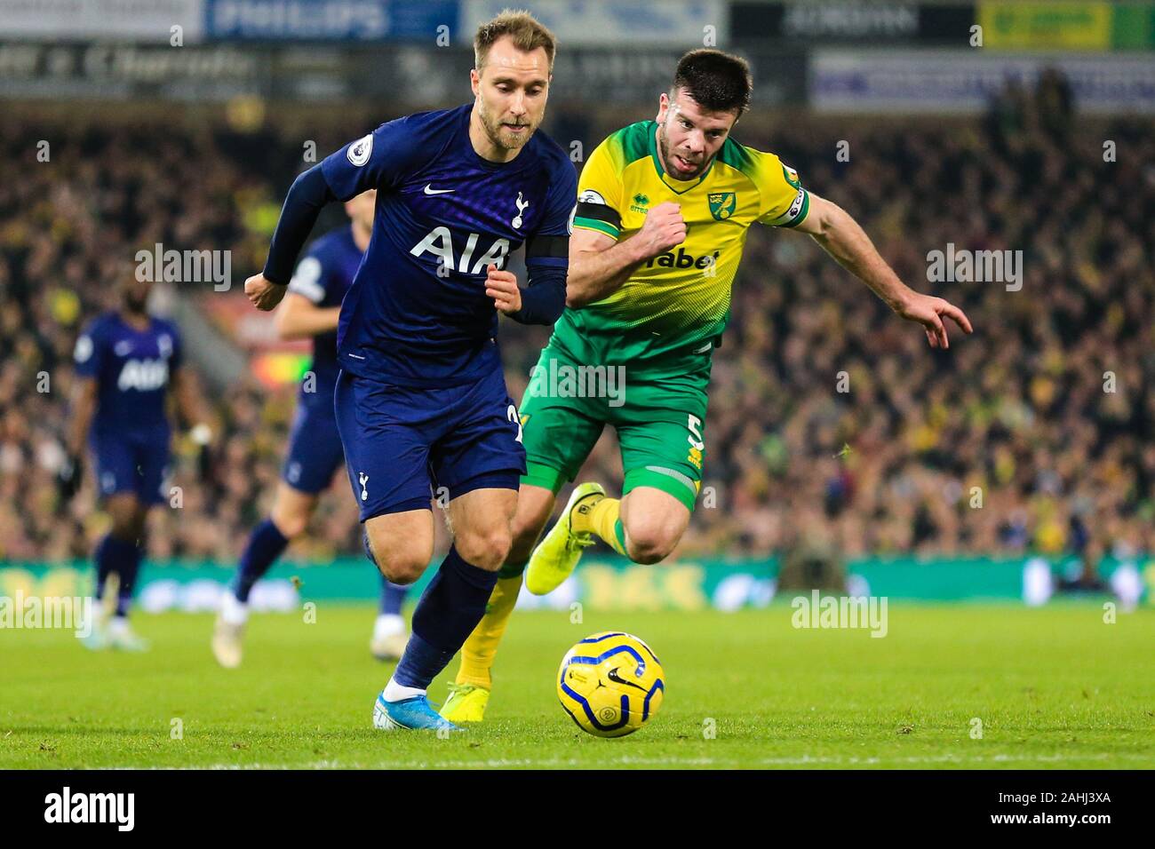 28th December 2019, Carrow Road, Norwich, England; Premier League, Norwich City v Tottenham Hotspur : Christian Eriksen (23) of Tottenham is chased by Grant Hanley (05) of Norwich City Credit: Georgie Kerr/News Images Stock Photo