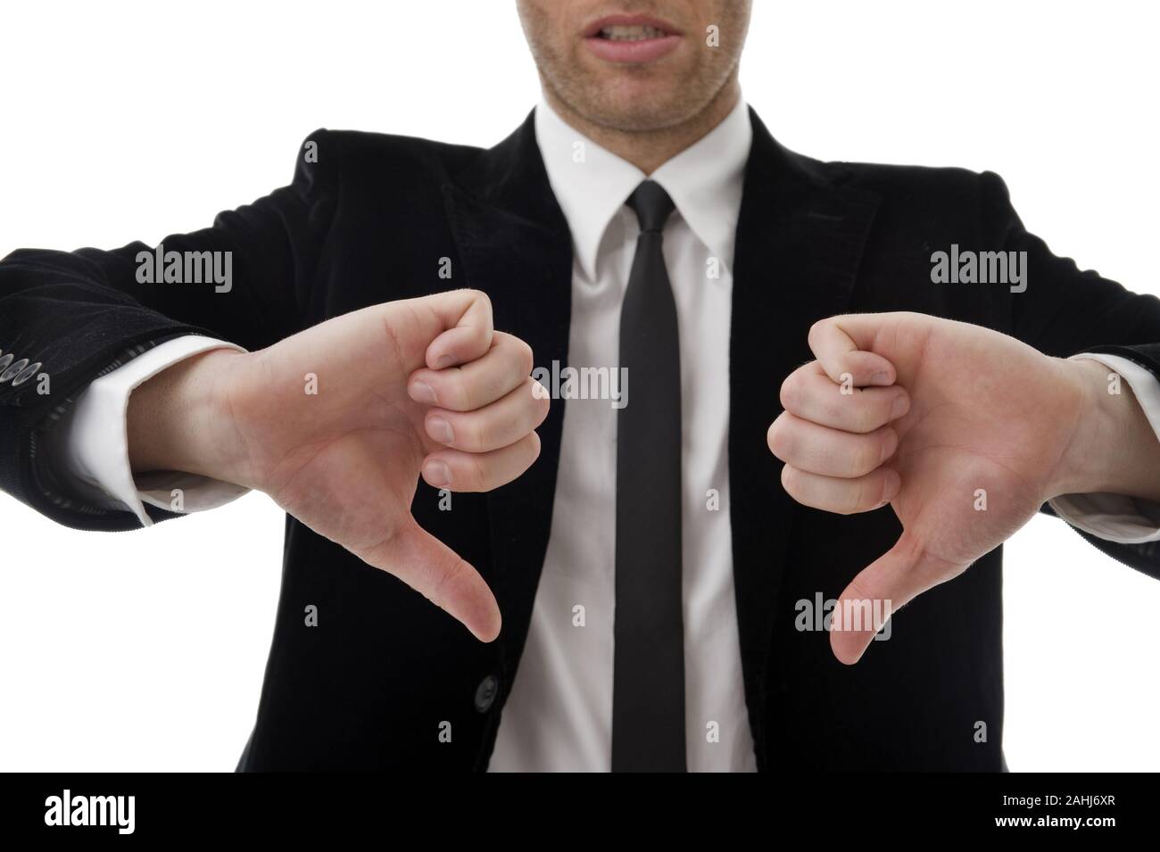 Geschäftsmann zeigt mid den Daumen nach unter, 40 Jahre alt, MR: Yes Stock Photo