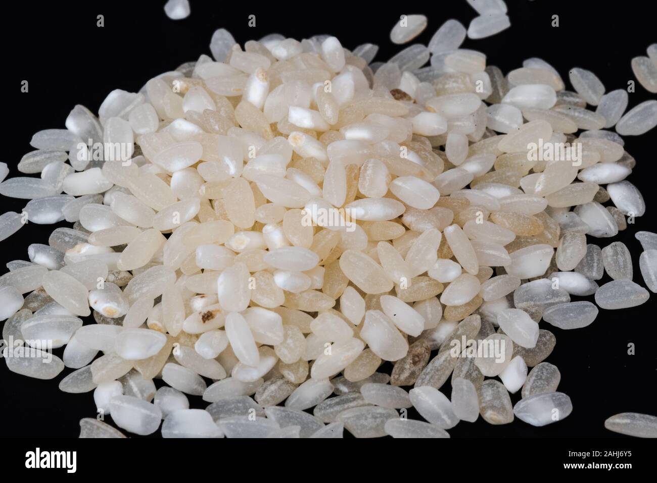 uncooked rice grains, a staple in any kitchen Stock Photo Alamy