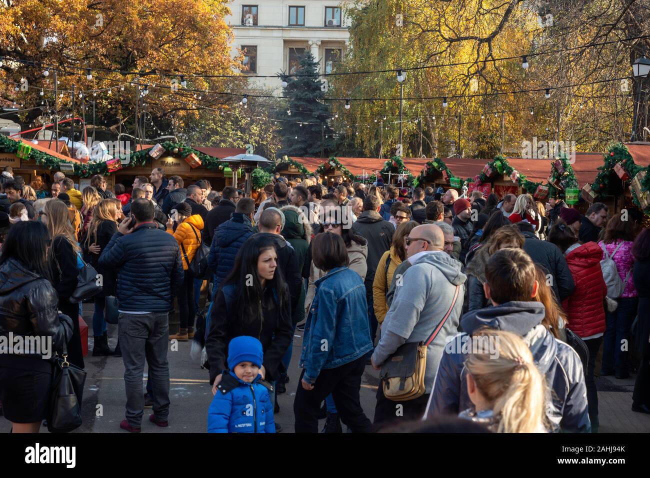 Sofia Bulgaria Christmas Market and crowd of people shopping on sunny