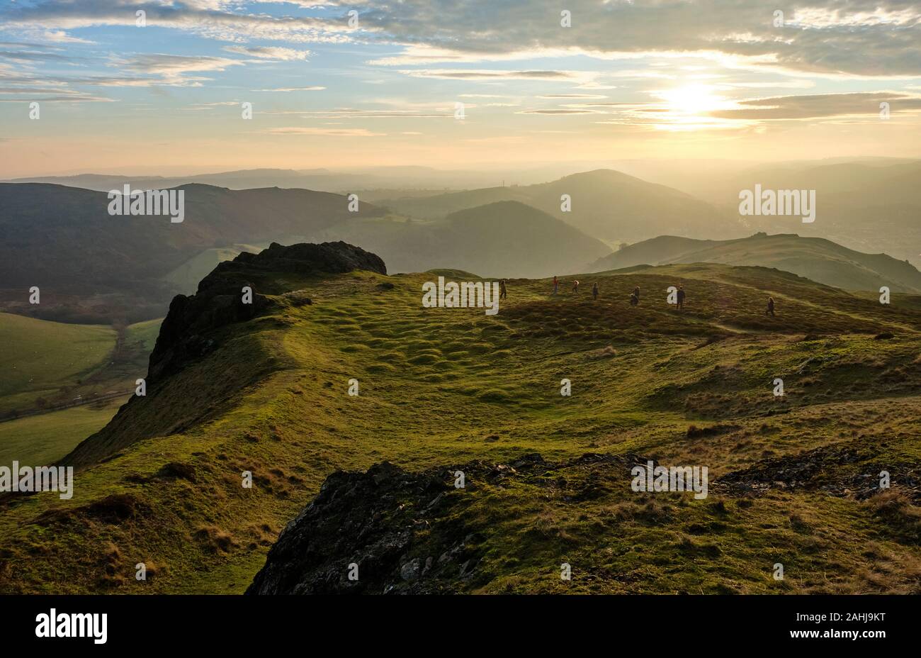 People playing on the lower summit slopes of Caer Caradoc, near Church Stretton, Shropshire Stock Photo
