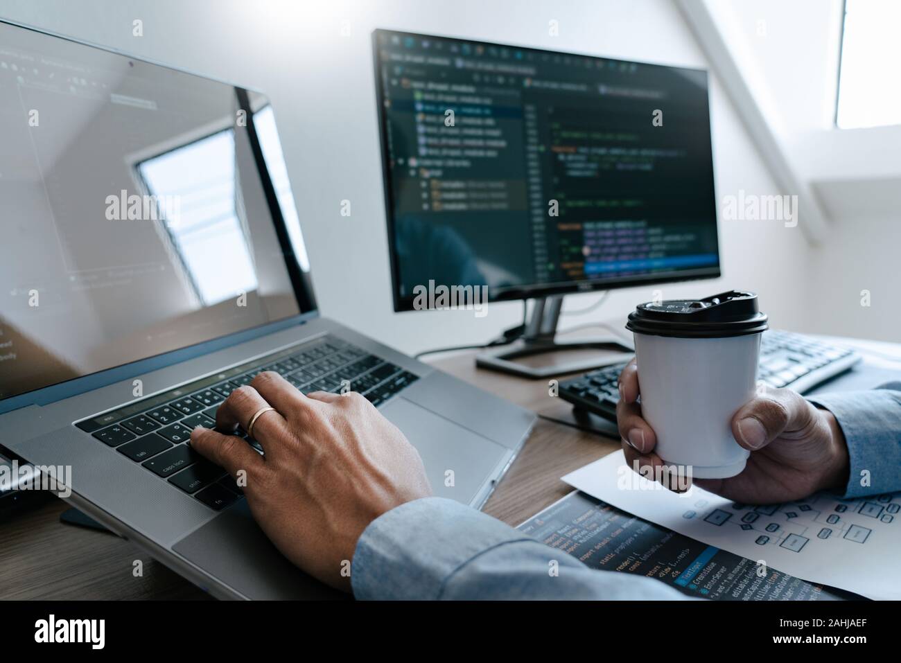 Programmer Typing Code on desktop computer, Developing programming and ...