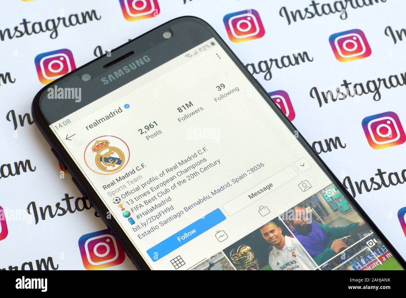 NY, USA - DECEMBER 4, 2019: Real Madrid official instagram account on smartphone screen on paper instagram banner. Stock Photo