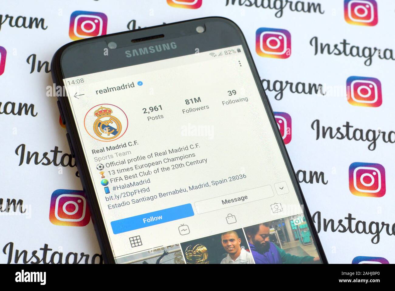 NY, USA - DECEMBER 4, 2019: Real Madrid official instagram account on smartphone screen on paper instagram banner. Stock Photo