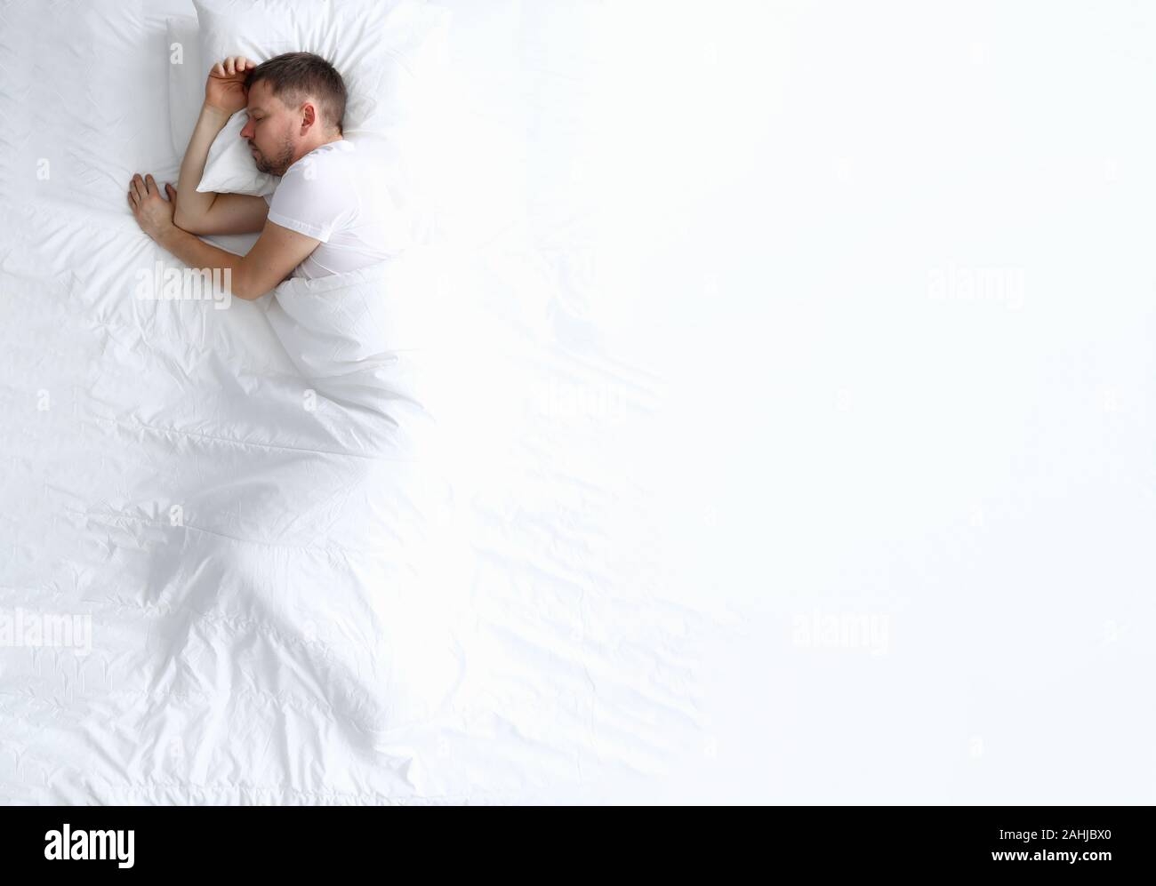 Young caucasian beauty woman sleeping on white bed Stock Photo - Alamy