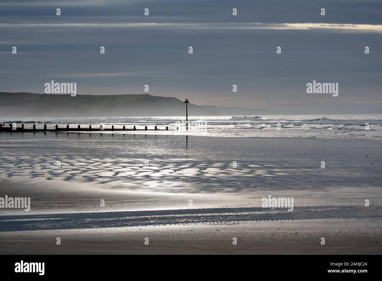 The empty beach at Borth, on the Welsh coast near Aberystwyth, seen in late December Stock Photo