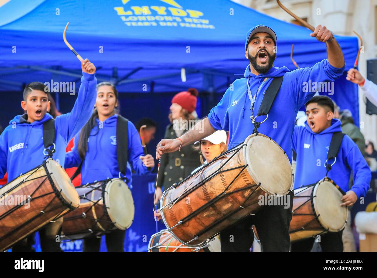 Covent Garden, London, 30th Dec 2019. London School of Dhol perform South Asian rhythms with their double-sided drums.The London New Year's Day Parade (or LNYDP) have chosen the vibrant Covent Garden Piazza for this year's preview event, showcasing several of their participating groups. The parade itself will start at 12 Noon on January 1st and proceed through central London. Credit: Imageplotter/Alamy Live News Stock Photo