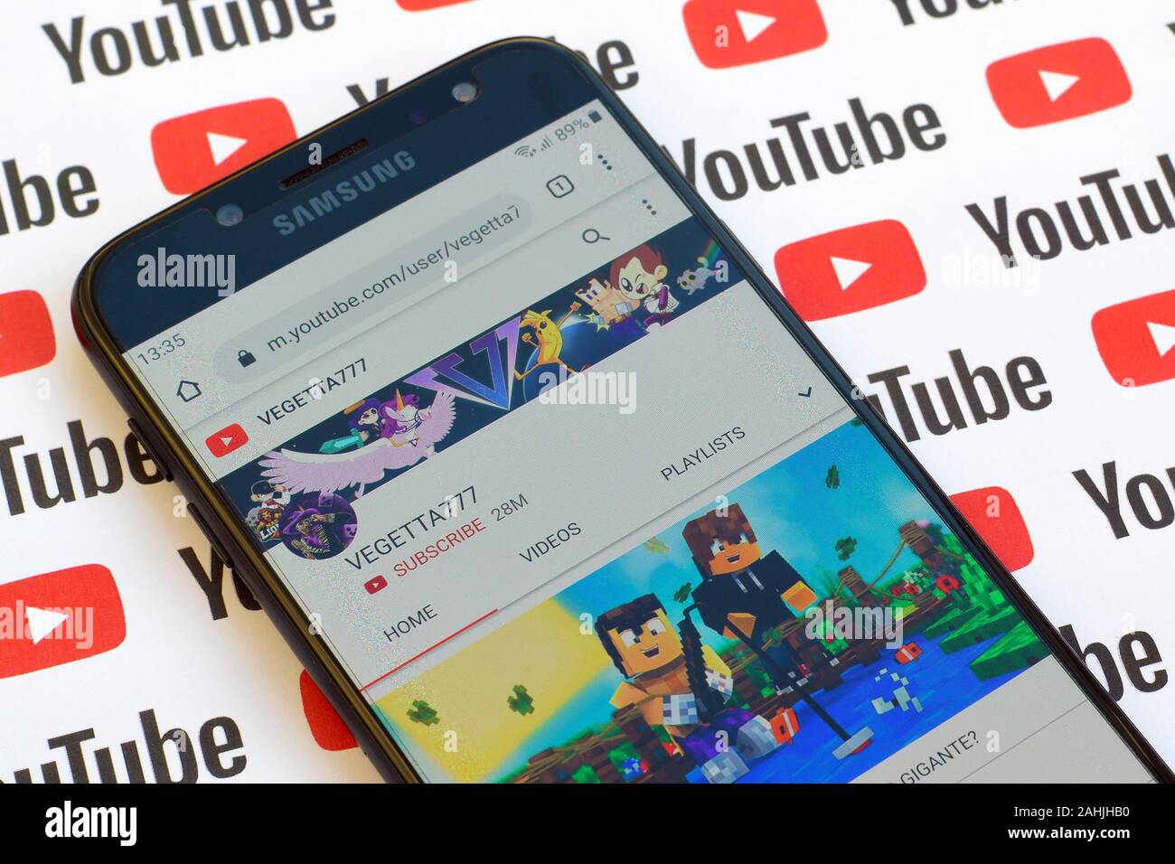 NY, USA - DECEMBER 4, 2019: Vegetta777 official youtube channel on smartphone screen on paper youtube background. Stock Photo