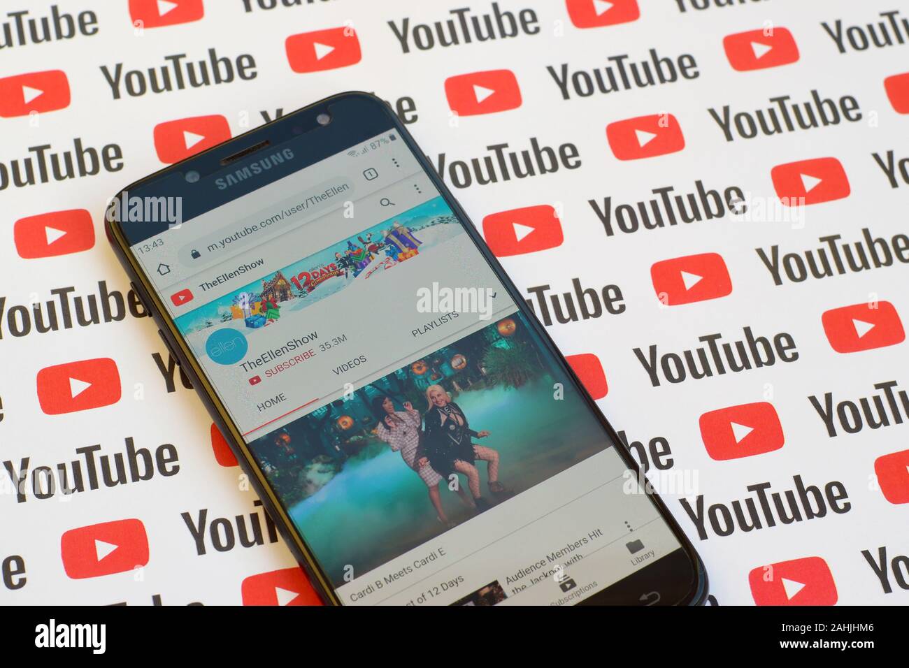 NY, USA - DECEMBER 4, 2019: TheEllenShow official youtube channel on smartphone screen on paper youtube background. Stock Photo