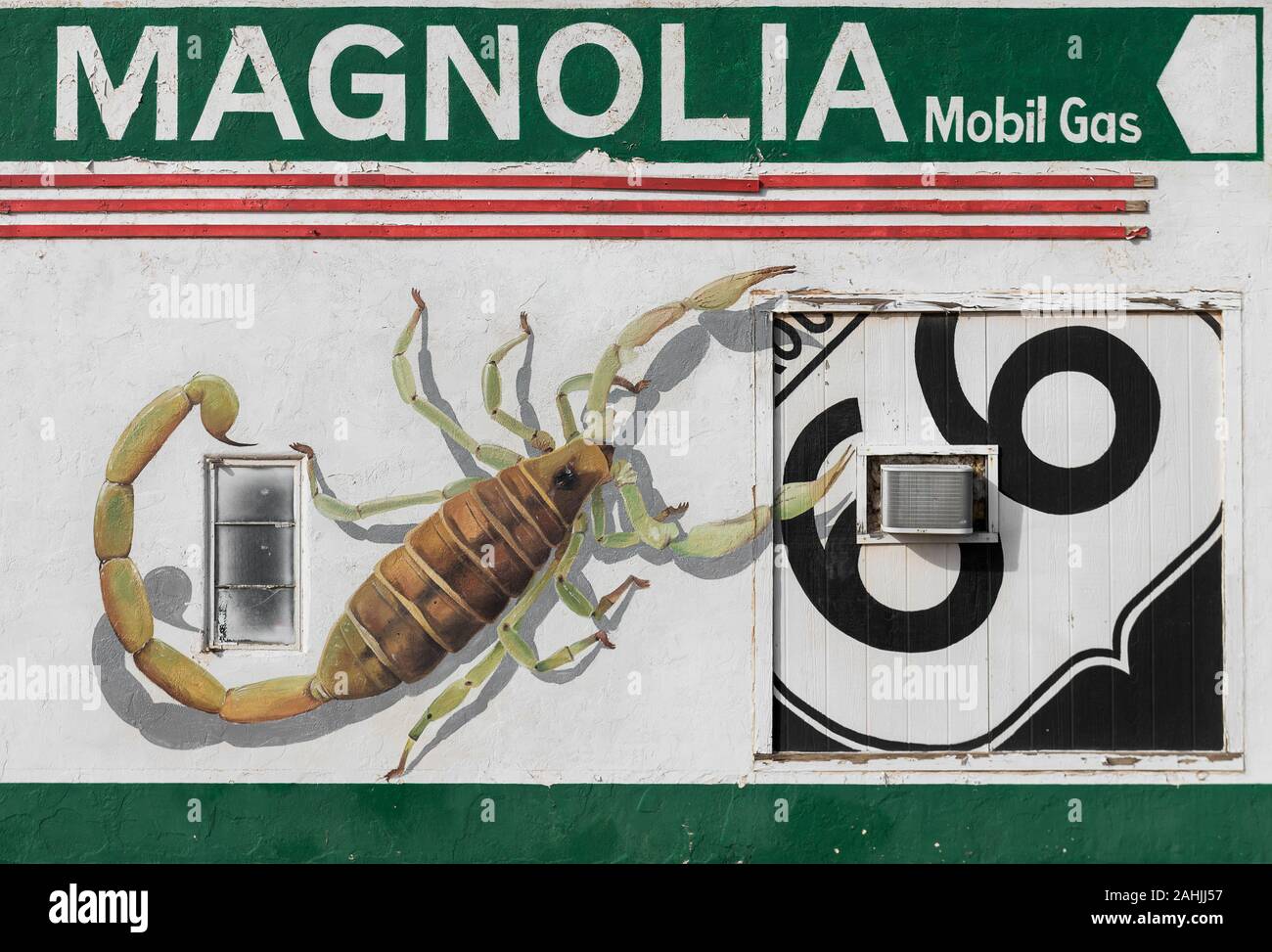 Old Magnolia gas station wall with scorpion on Route 66 in Tucumcari, New Mexico Stock Photo
