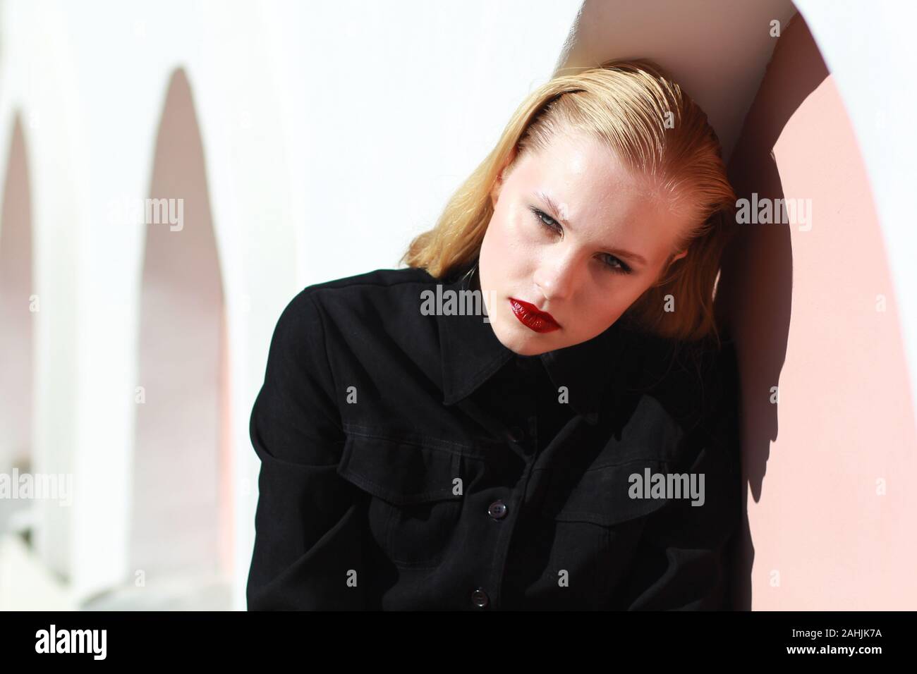 Fashion model in black clothing. Harmoniously similar
