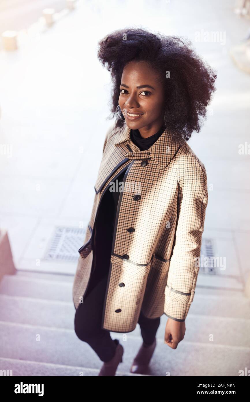 Beautiful african american young woman with afro and large hoop ...