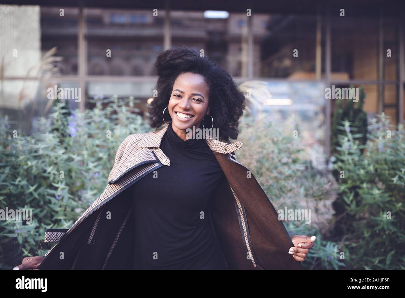 Beautiful african american young woman with afro and large hoop ...