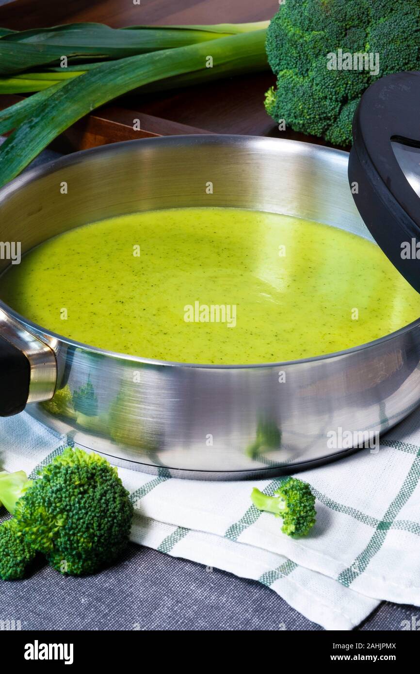 Delicious homemade green cream of broccoli soup with leek. Stock Photo