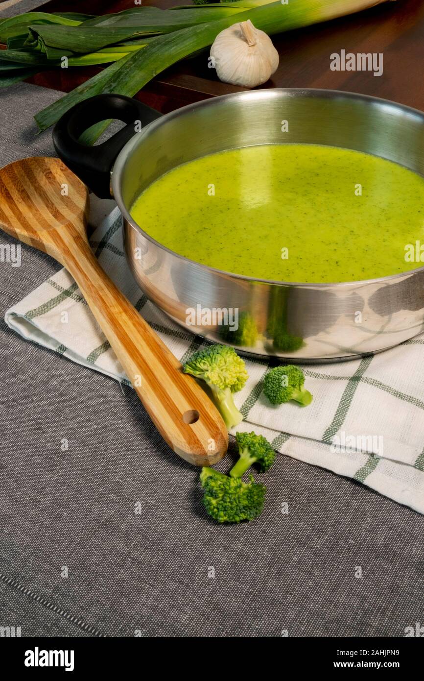 Delicious homemade green cream of broccoli soup with leek. Stock Photo