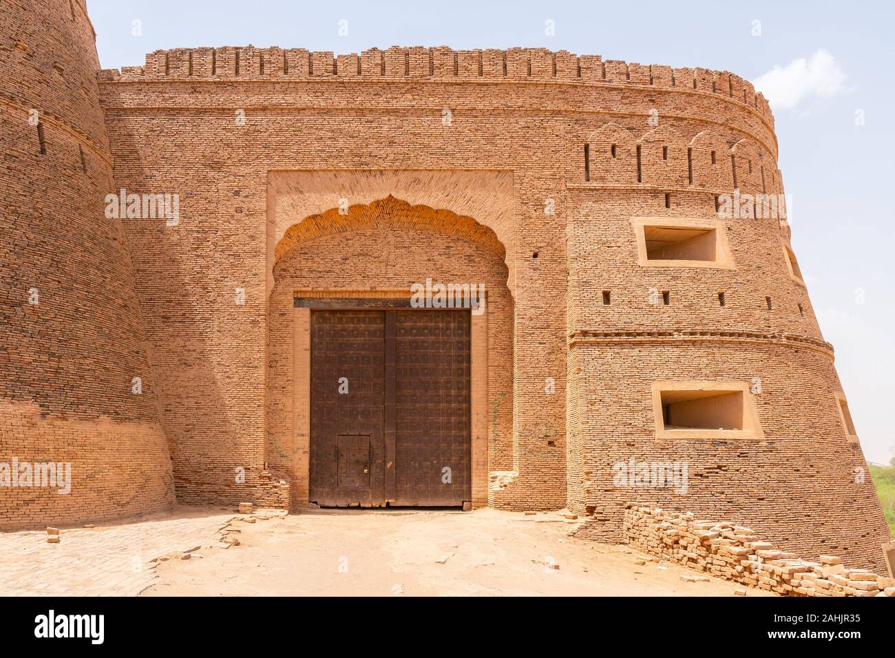 Derawar Bhatti Fort Walls Picturesque Breathtaking View of the Entrance Gate on a Sunny Blue Sky Day Stock Photo