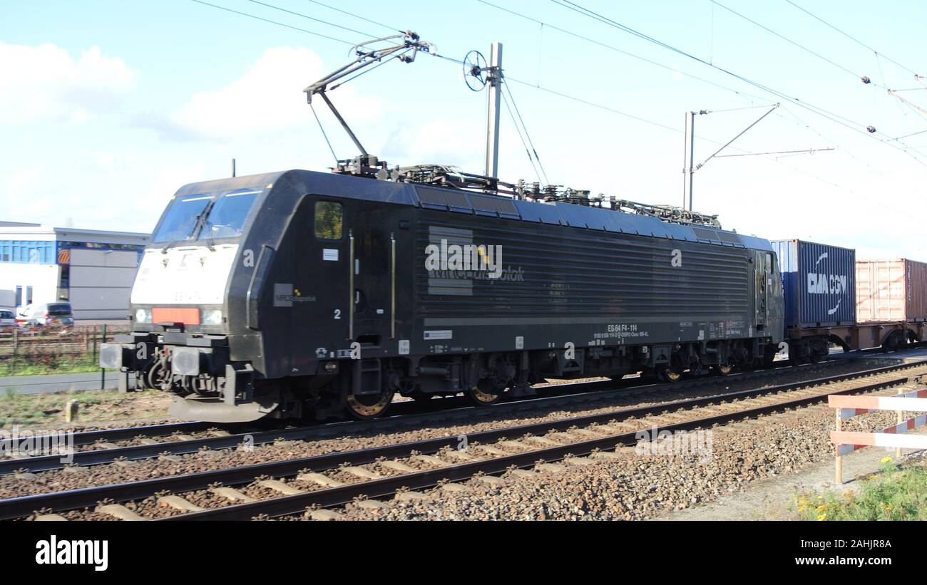 Class 189 electric locomotive with cargo wagons exiting Venlo, Holland. Stock Photo