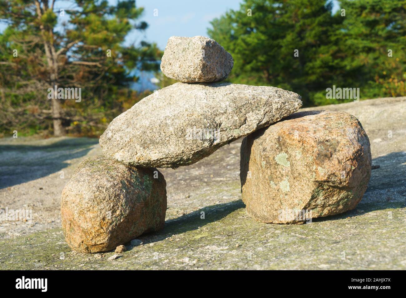 Acadia Bates Cairn on a granite slab, marking the hiking trail on Cadillac Mountain, Acadia National Park, Maine, USA. Stock Photo