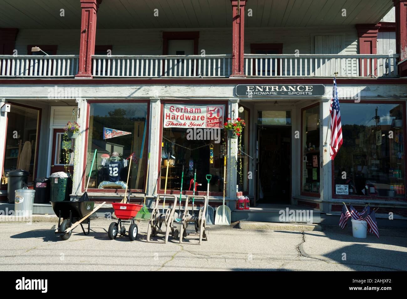 Exterior of an old hardware store with merchandise displayed on the sidewalk, Gorham, New Hampshire, USA. Stock Photo
