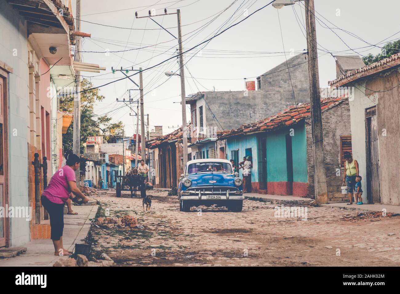 TRINIDAD, CUBA - DECEMBER 16, 2019: Colorful houses and vintage cars in Trinidad, Cuba. Unesco World Heritage Site. Stock Photo