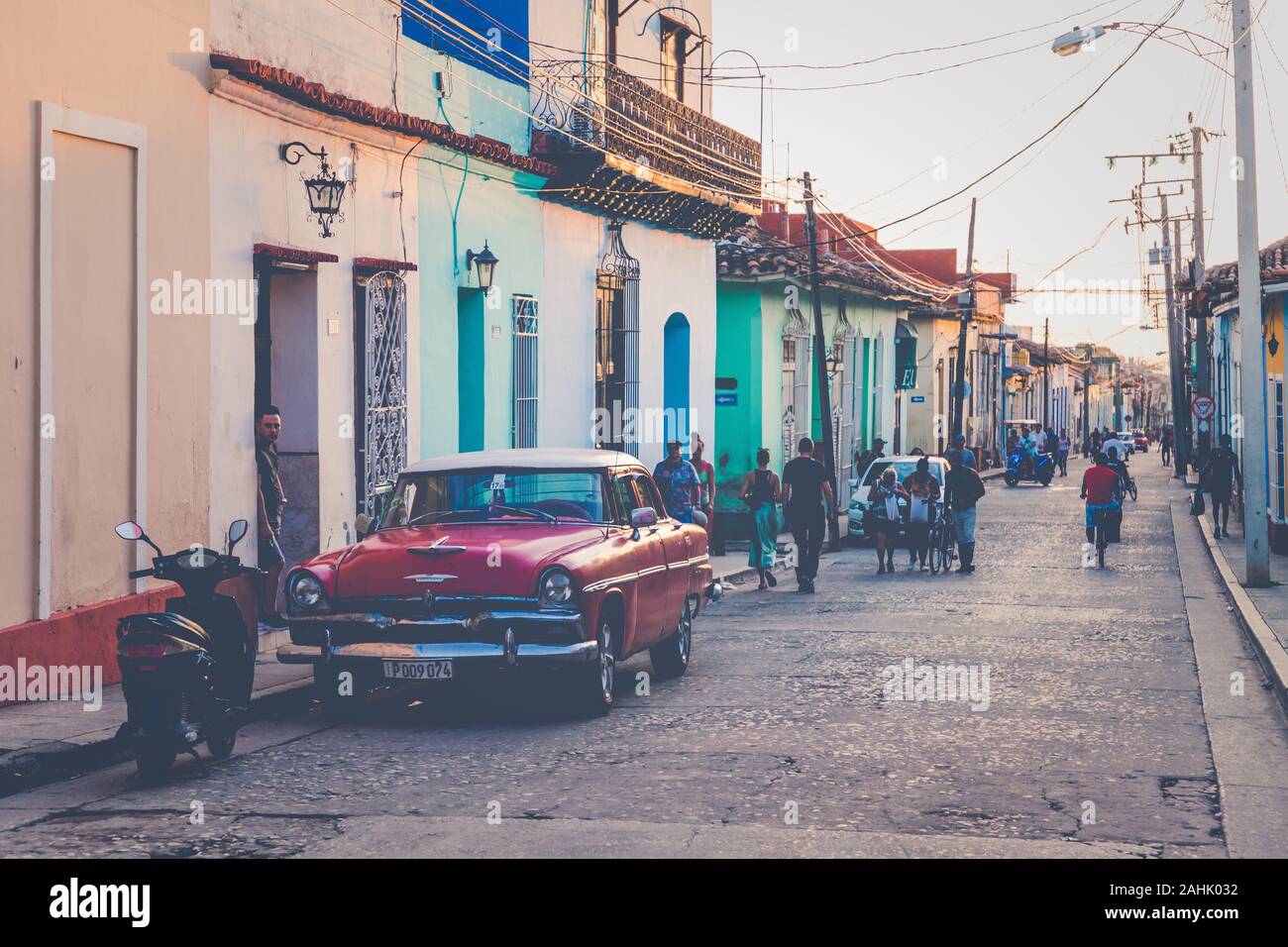 TRINIDAD, CUBA - DECEMBER 16, 2019: Colorful houses and vintage cars in Trinidad, Cuba. Unesco World Heritage Site. Stock Photo