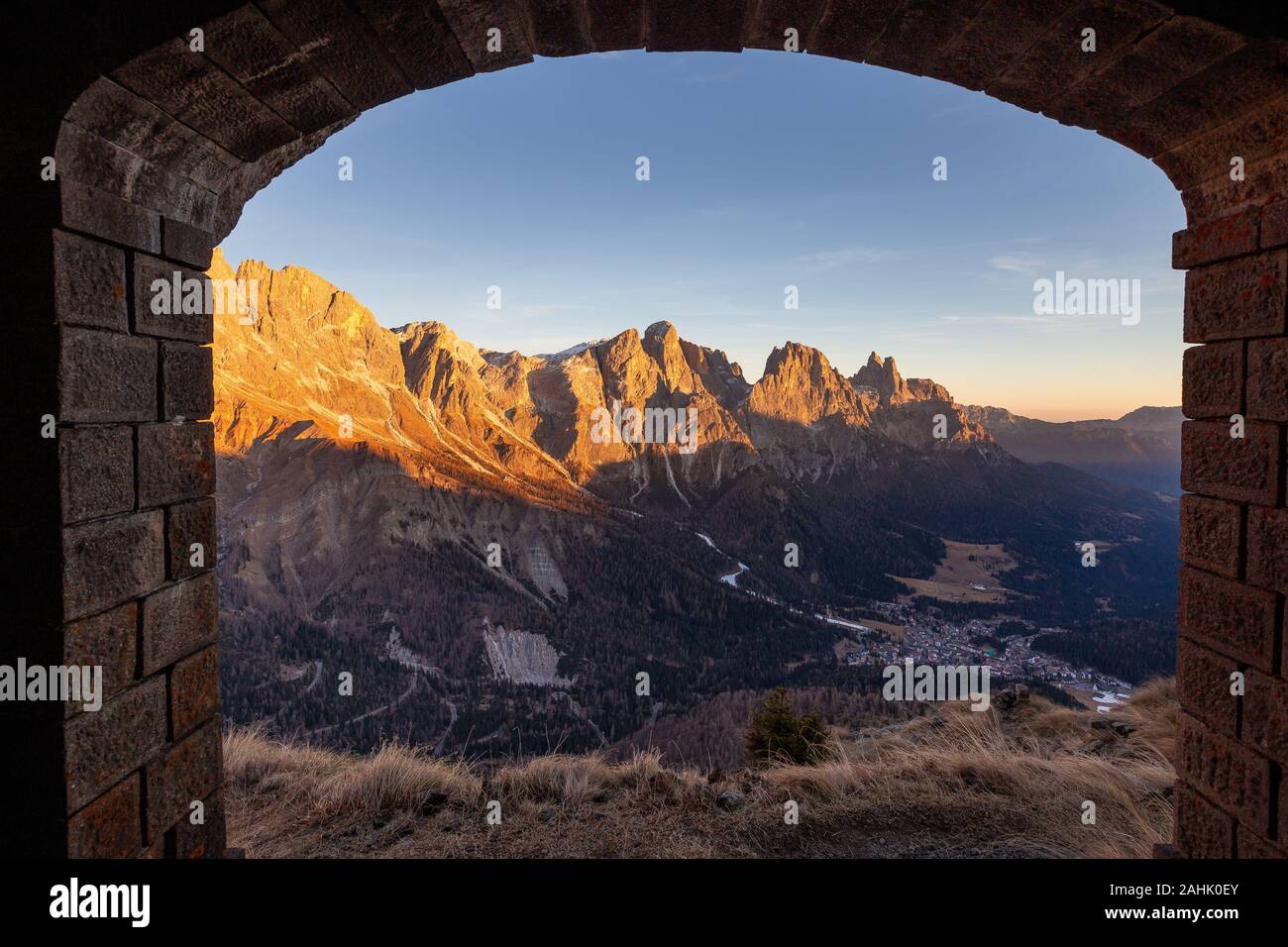 Alpenglow at sunset on the Pale di San Martino mountain group. View on San Martino di Castrozza town. The Dolomites of Trentino. Italian Alps, Europe. Stock Photo
