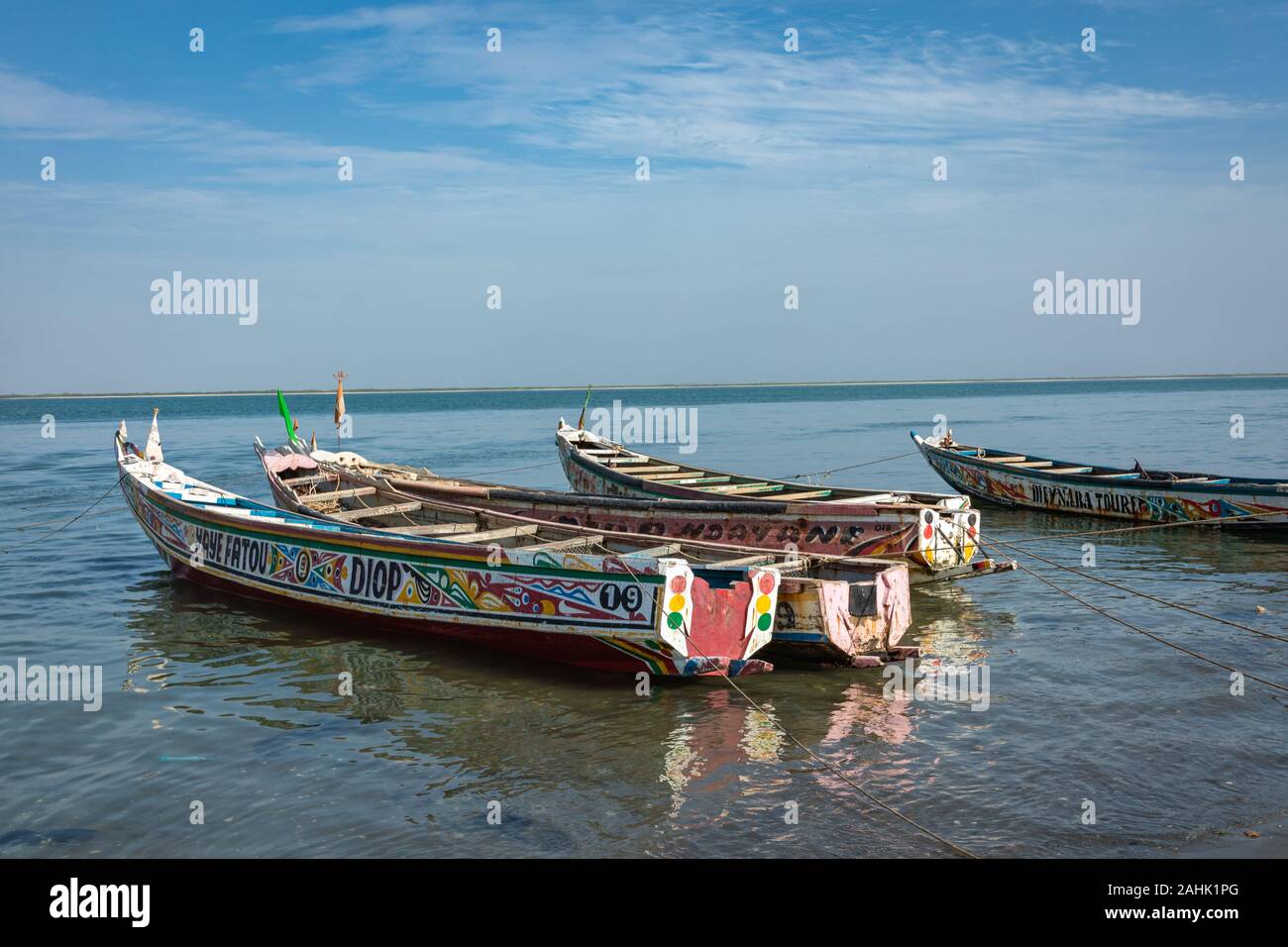 Traditional painted wooden fishing boat in Djiffer, Senegal. West Africa. Stock Photo