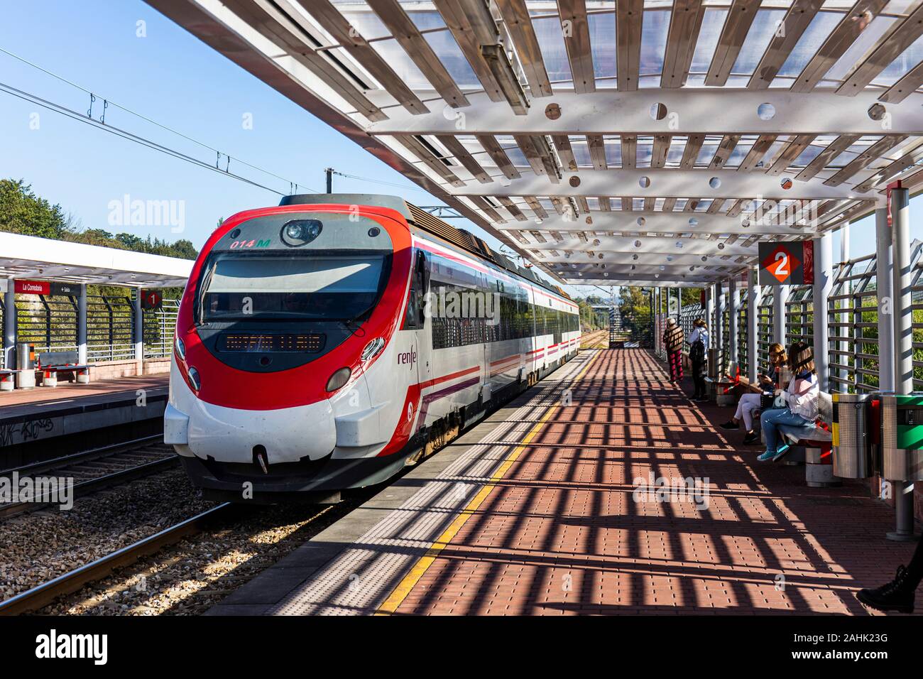 A modern Commuter train arriving at train station at Urb. Pintado,, Oviedo Spain - Stock Photo