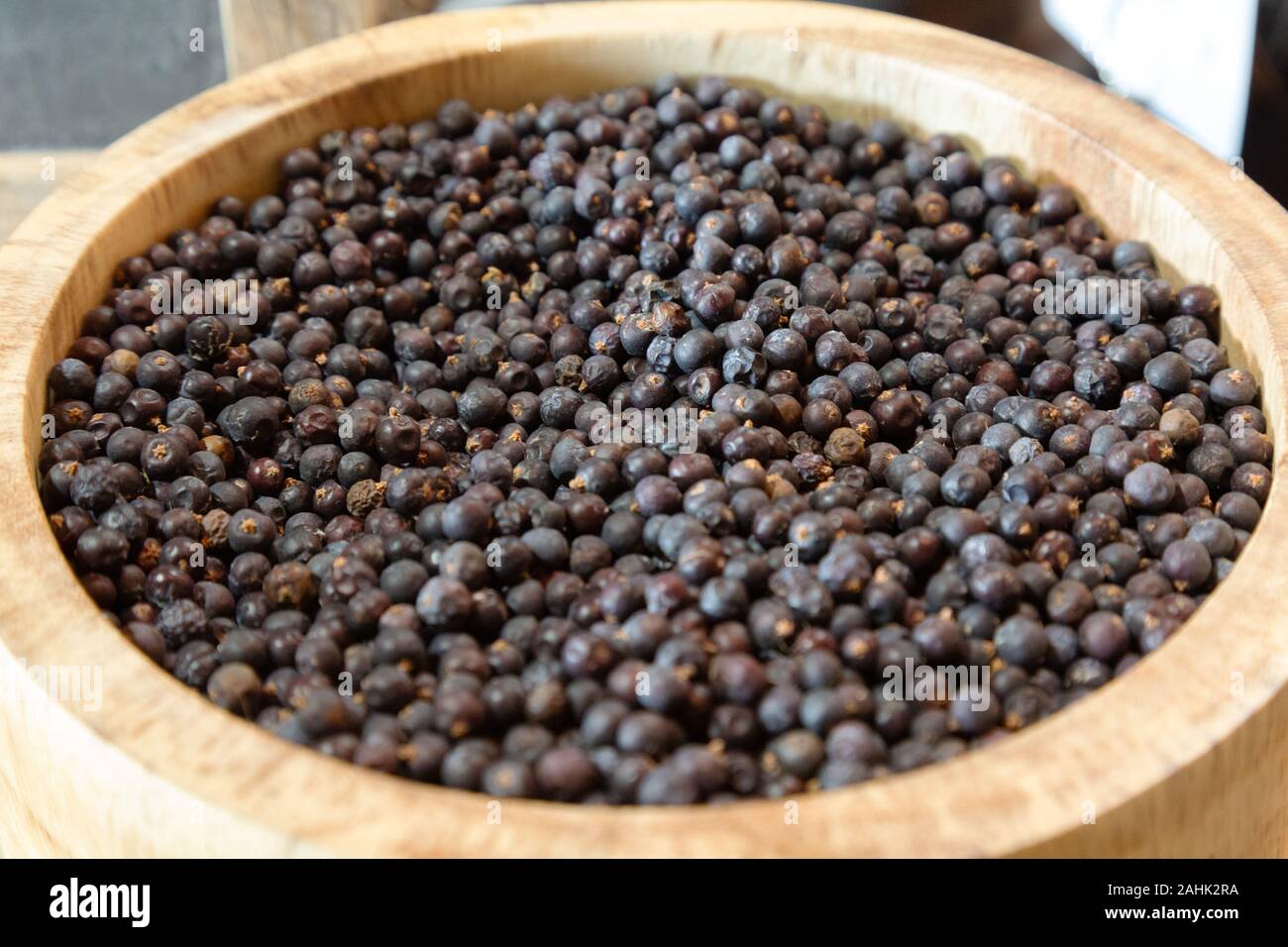 A bowl of Juniper berries used to make Gin Stock Photo