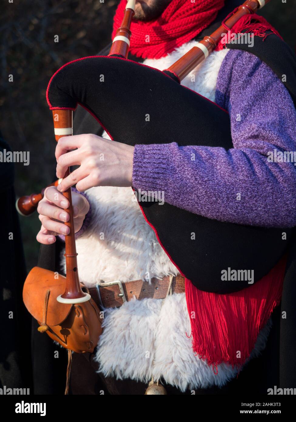 Bagpipe player in gowns during a traditional festival. Stock Photo