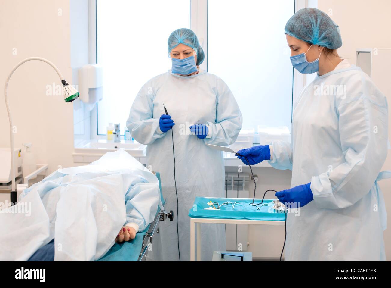 Doctors during a mole removal surgery Stock Photo - Alamy