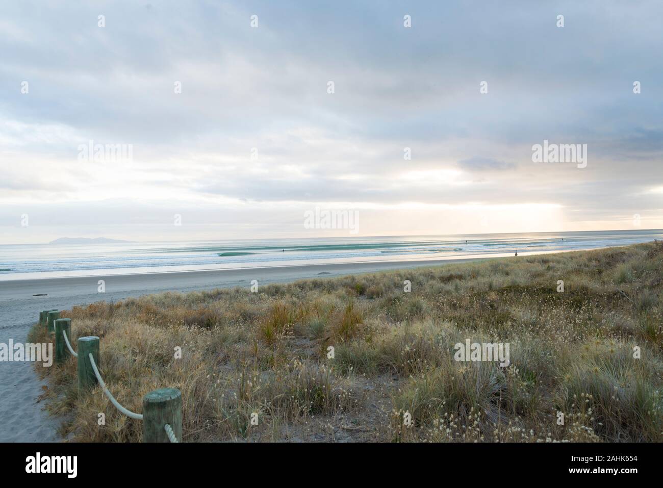 Beach path to Waihi beach with morning sunrise Stock Photo Alamy