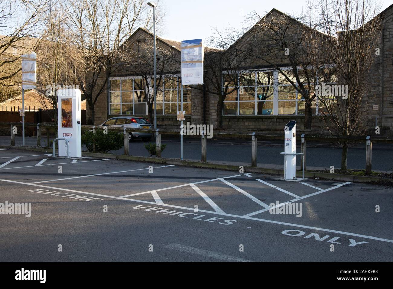 An electric car charging podpoint showing two types of charging point, waiting to be commissioned at a Tesco store in Greenfield, Oldham, UK Stock Photo
