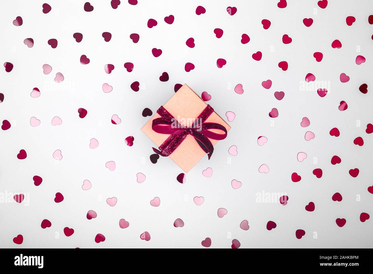 Craft box with dark red velvet ribbon bow and glitter heart confetti ...