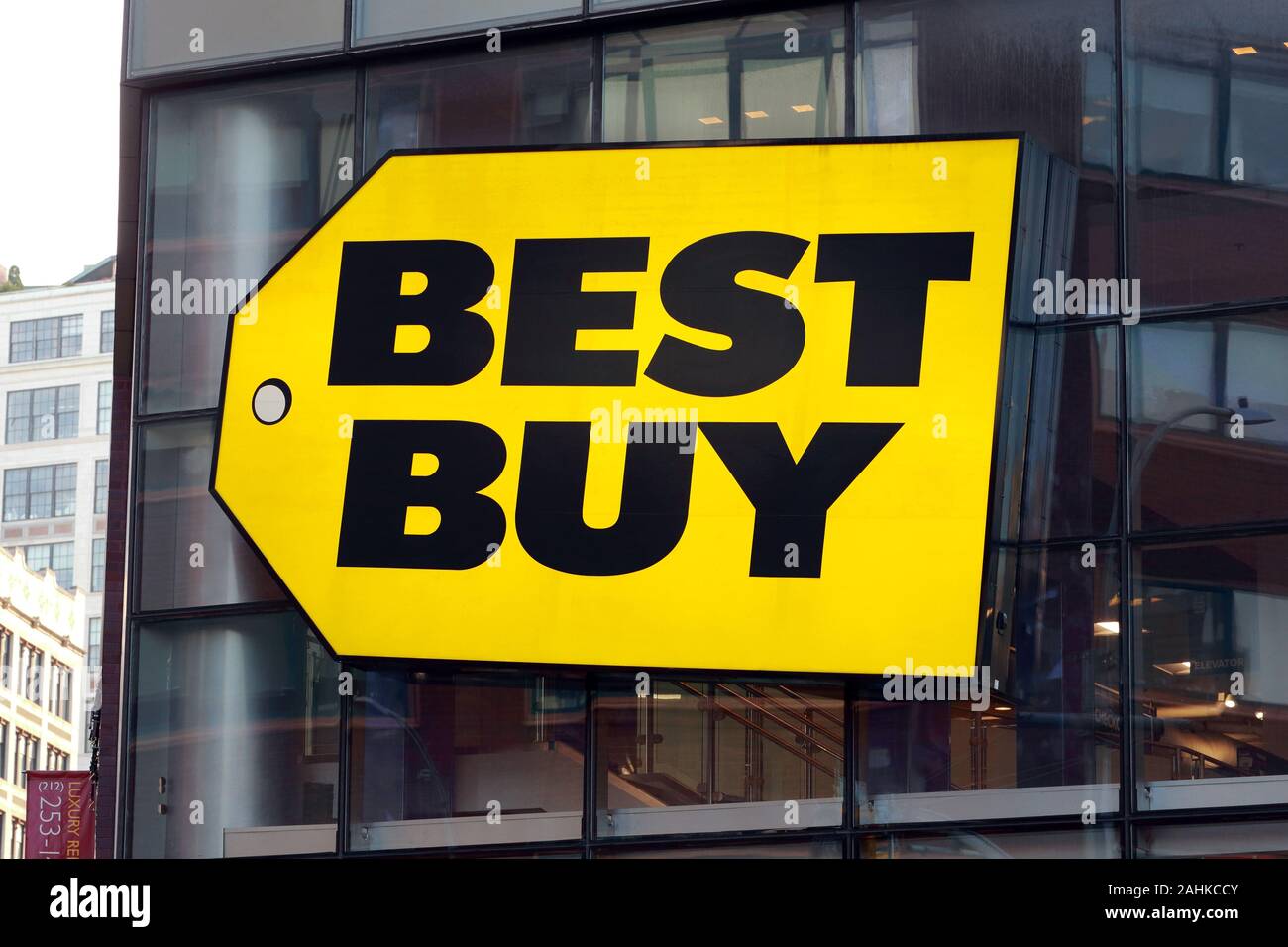 A gigantic Best Buy logo on a building with glass and steel construction in the Union Square neighborhood of Manhattan, New York, NY Stock Photo