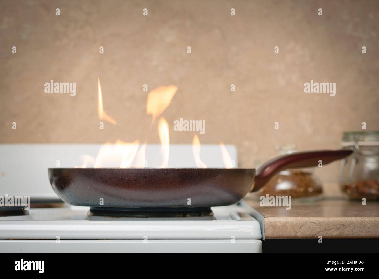 Burning Fire In Frying Pan On The Stove Electric Burner On The