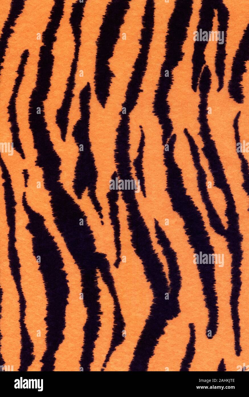 Orange and black striped animal print background. This is a high resolution scan of a piece of fabric showing all the detail. Stock Photo