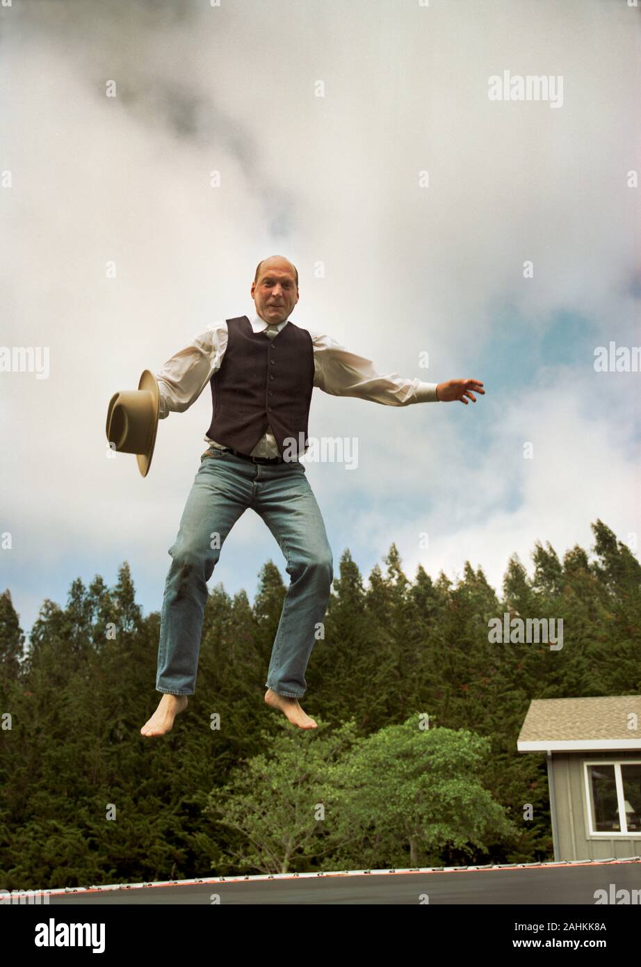 Man jumping on trampoline Stock Photo Alamy