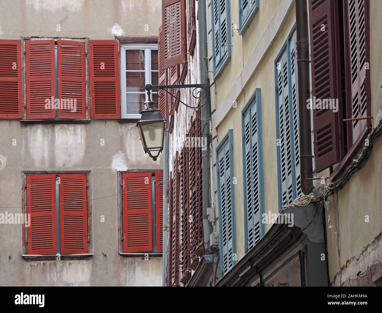 vernacular buildings in the streets of the city of Bayonne, with typical wooden shuttered windows, timbered facades and bronze lanterns  France,Europe Stock Photo