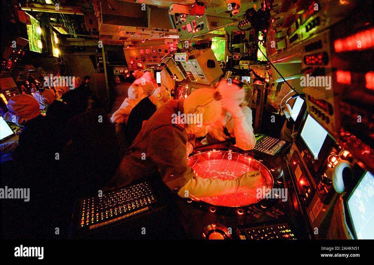 The Operations Room aboard HMS Liverpool (D 92), a Royal Navy Type 42 Batch 2 destroyer, during an air defence exercise. They are using the Ferranti ADAWS 8 with ADIMP, interfacing with all weapons, sensors, ESM, radar and navigational equipment. Liverpool was commissioned in 1982 and paid off in 2012. Stock Photo