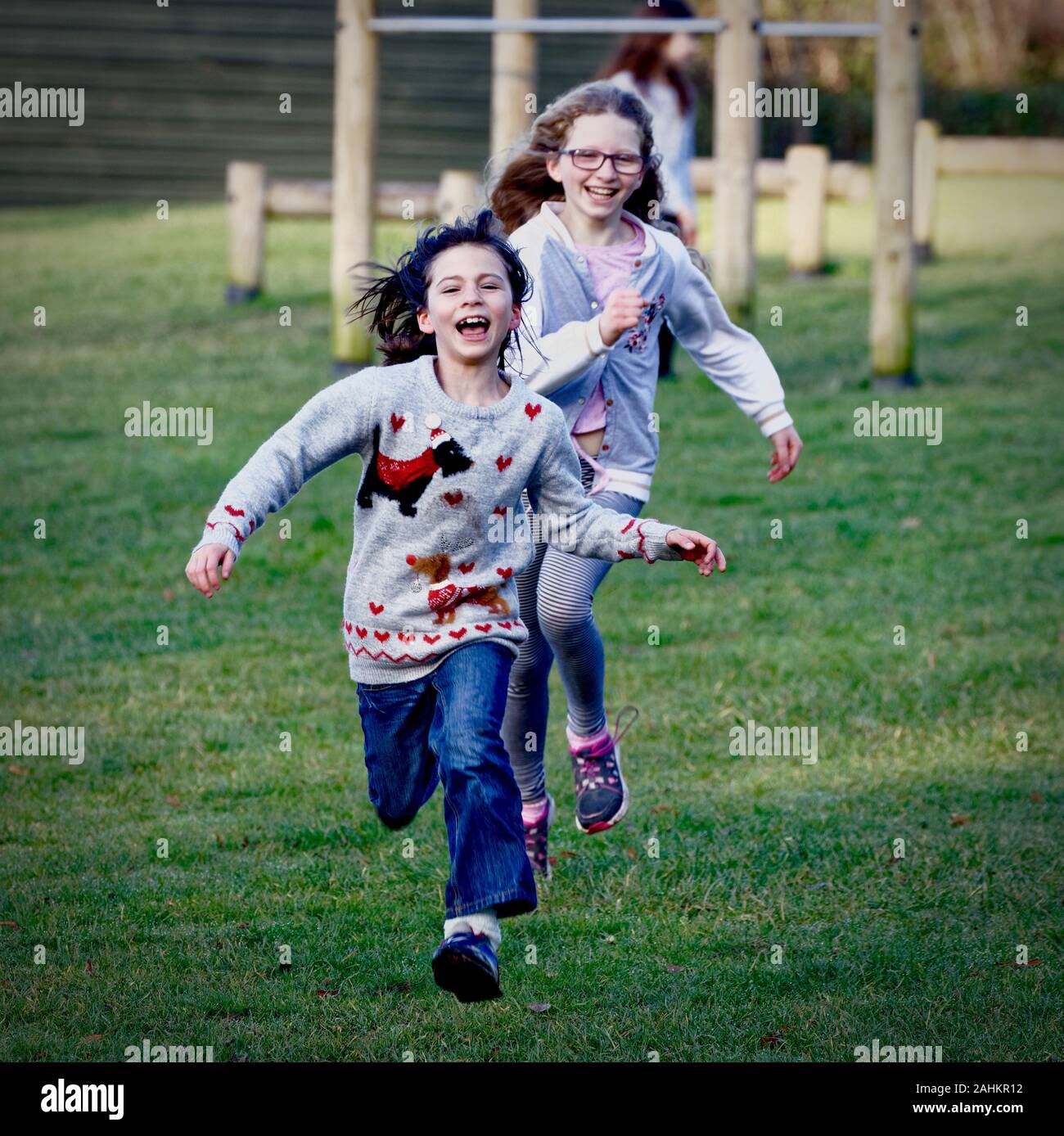 Children running in a park Stock Photo