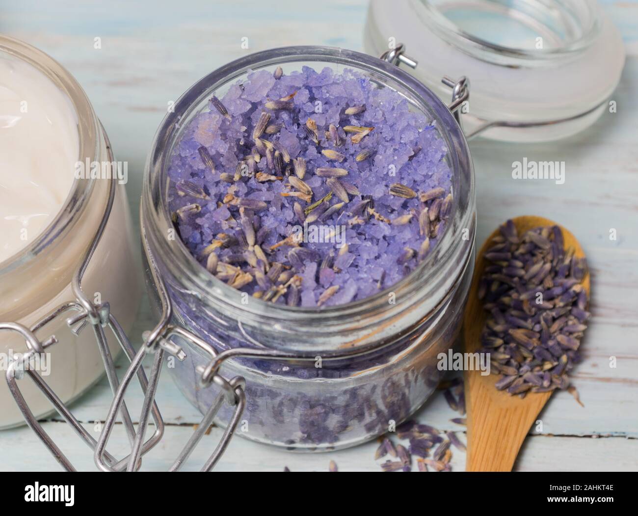 Homemade spa of lavender bath salts on a light wooden background. Cosmetics and natural medicine. Stock Photo
