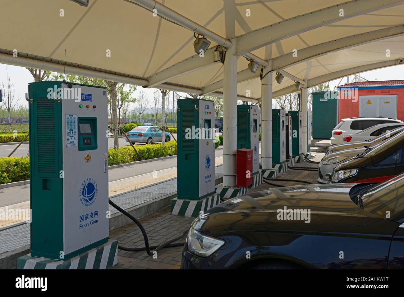 A State Grid electric car charging station on a street outside Yujiabao railway station in Binhai district, Tianjin city, China Stock Photo